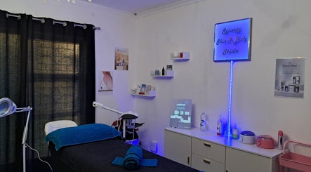 Synergy Skin And Body Studio treatment room in Cape Town, Western Cape, ZA featuring elegant decor and equipment.