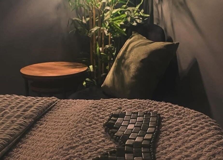 Peaceful massage room at Relax & Restore Massage Therapy, Basingstoke, England, GB with cozy lighting.