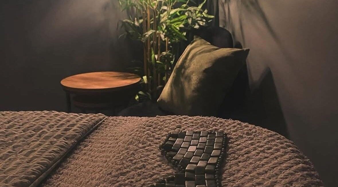 Peaceful massage room at Relax & Restore Massage Therapy, Basingstoke, England, GB with cozy lighting.