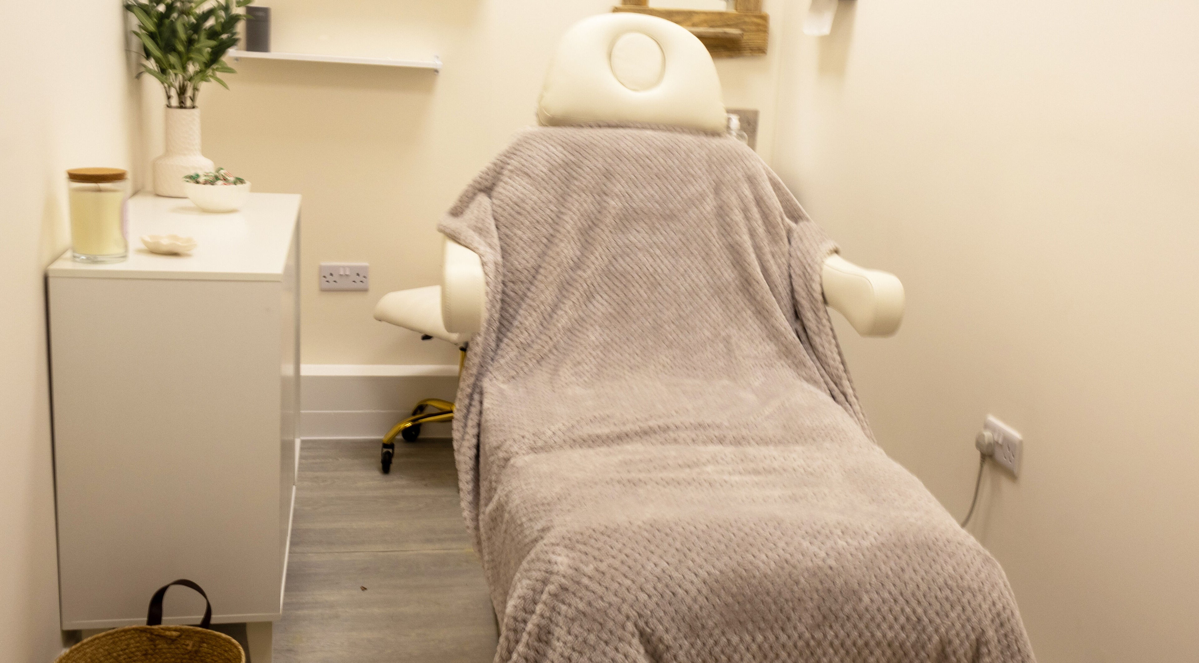Cozy treatment room with a plush chair at Look at You in Poole, England, GB.