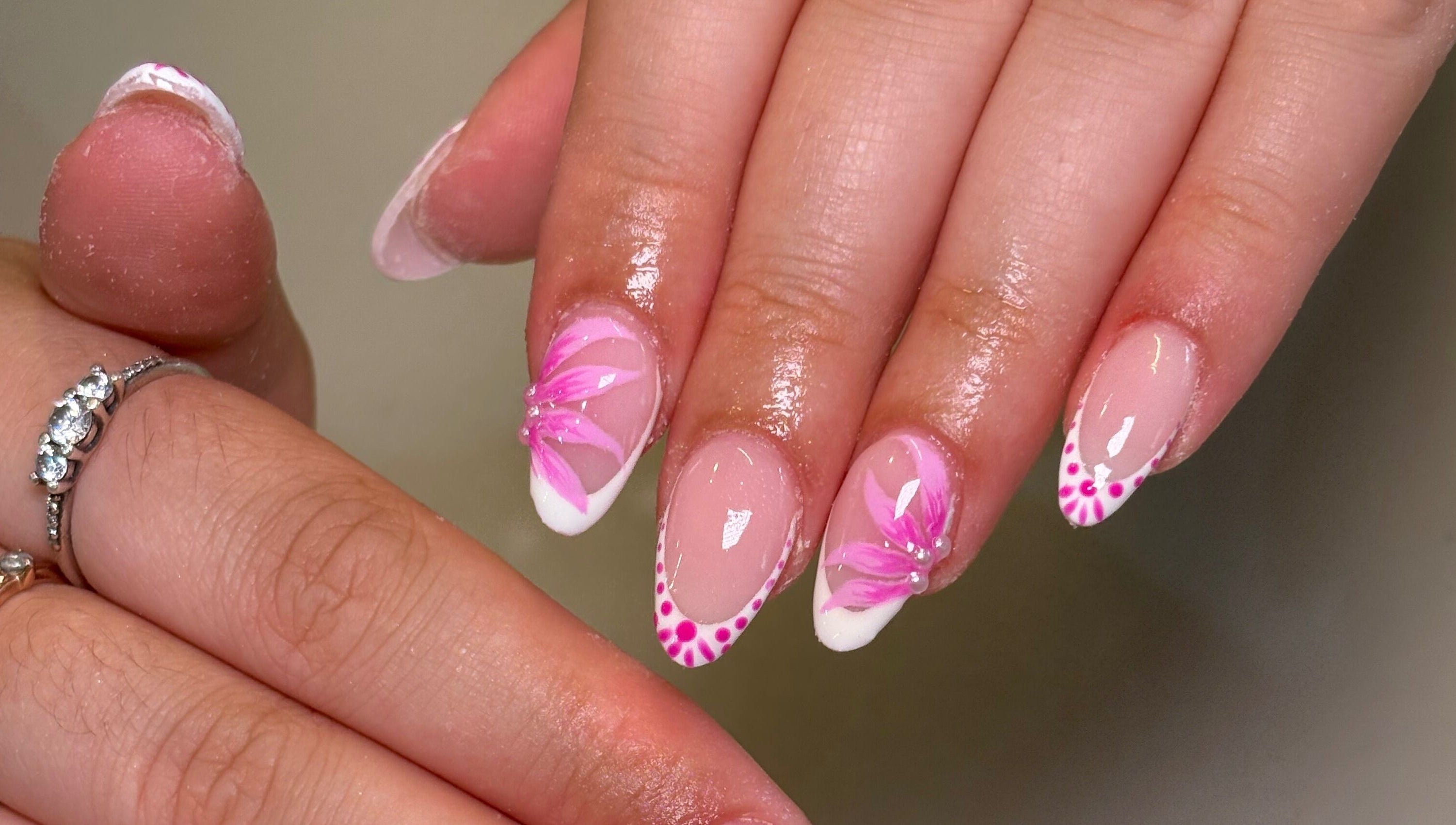 Pink floral nail art at Nails by Emily Katie, Burnley, England, GB. Elegant and detailed manicure design.