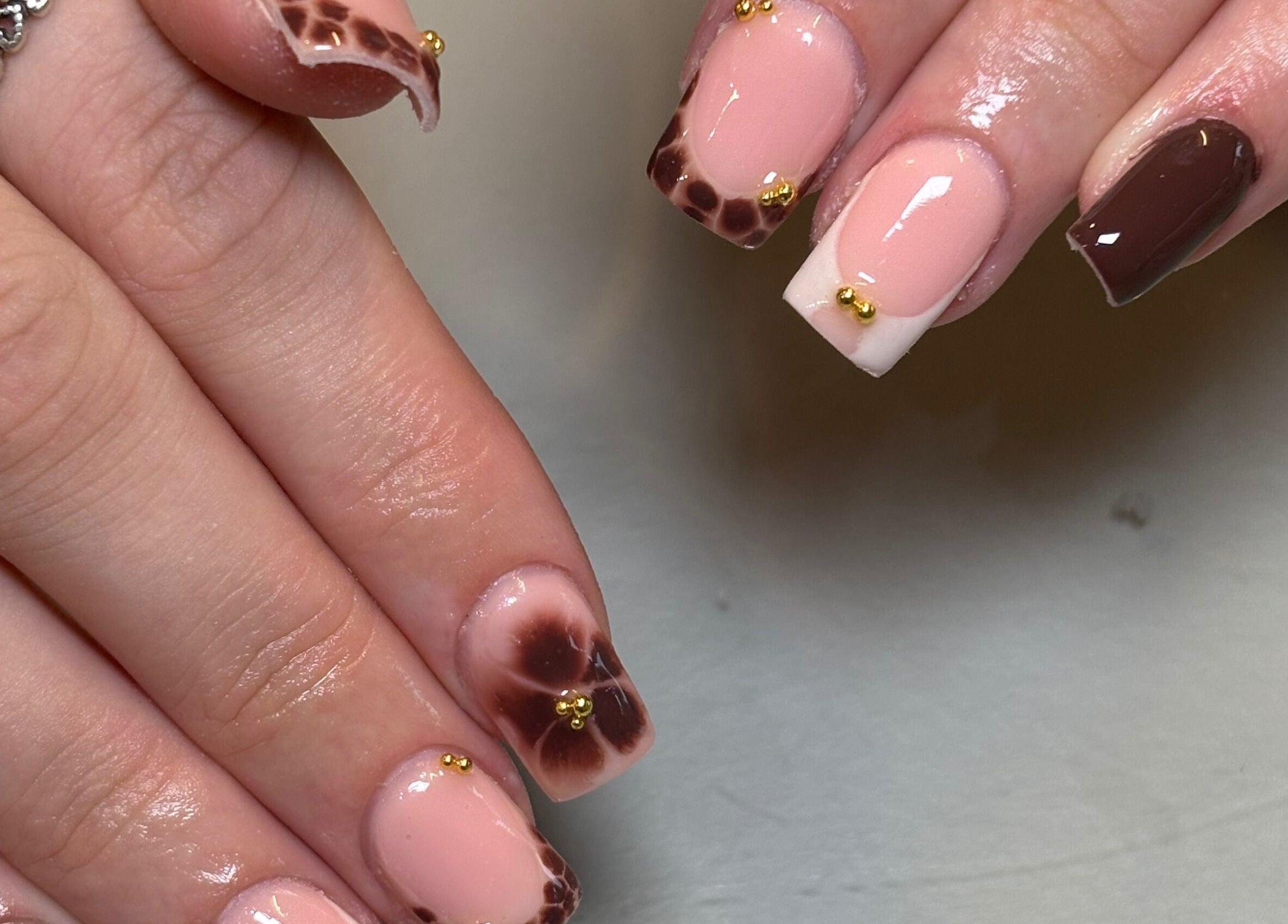 Stylish marble nail art with gold accents by Nails by Emily Katie in Burnley, England, GB.