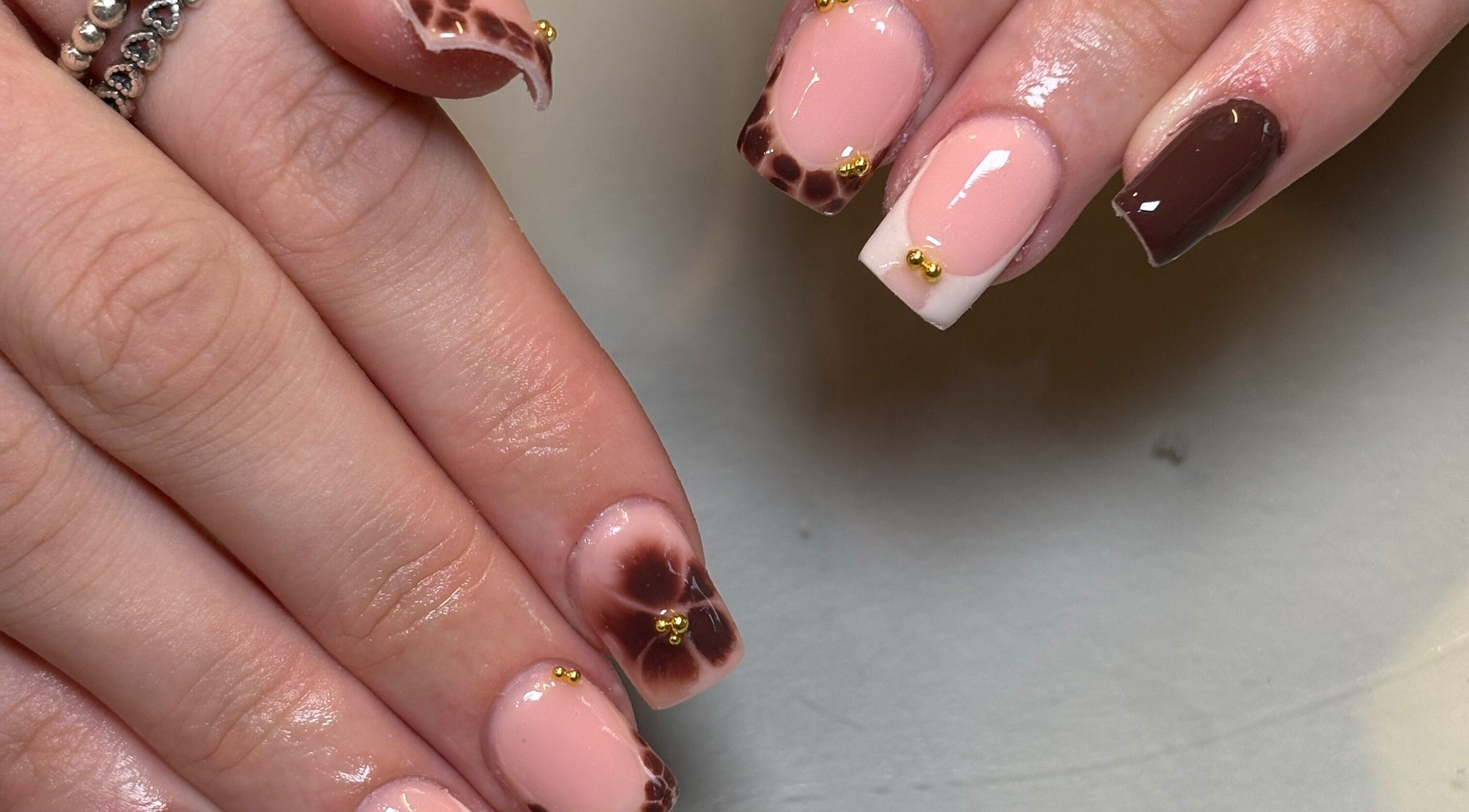 Stylish marble nail art with gold accents by Nails by Emily Katie in Burnley, England, GB.