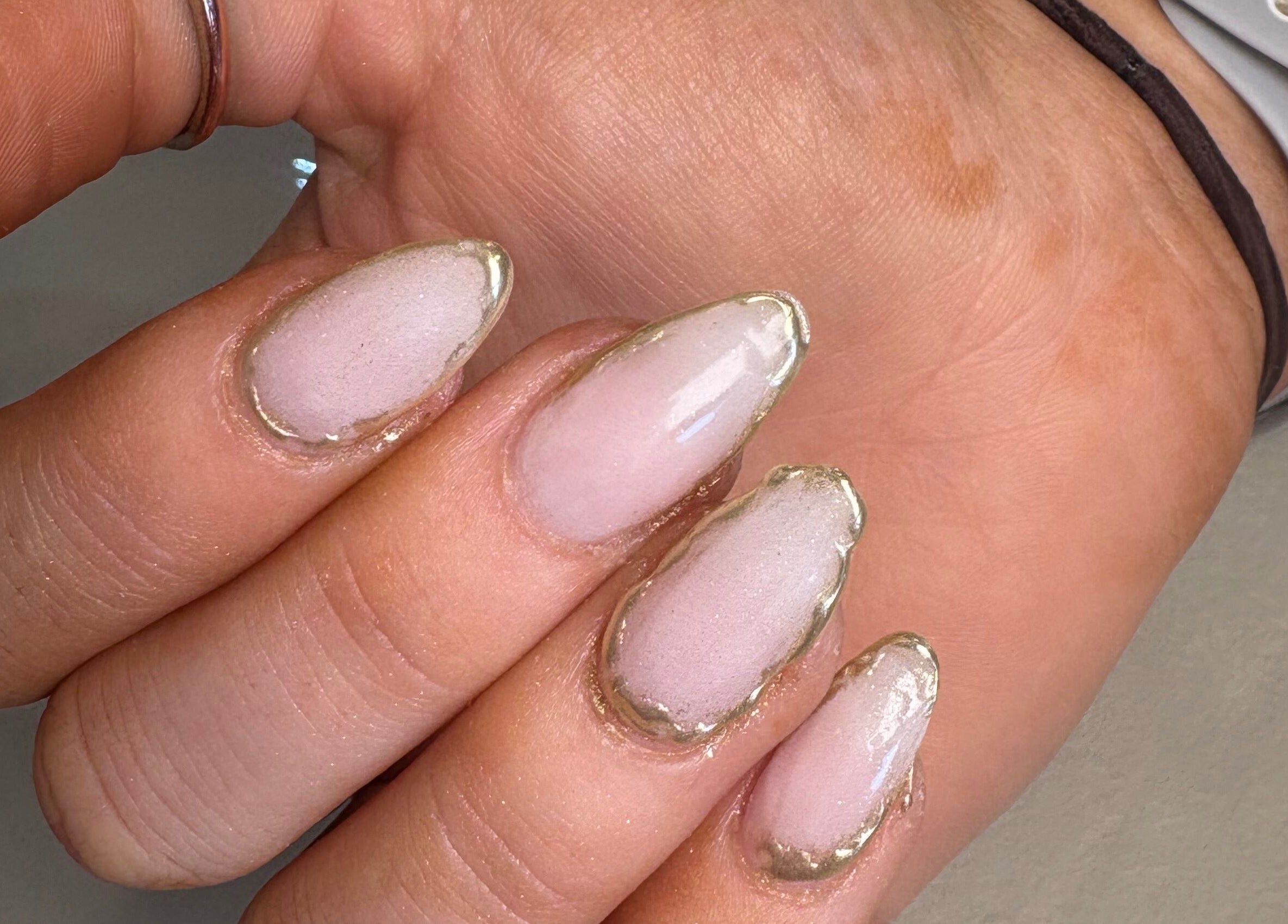 Elegant manicure with gold accents at Nails by Emily Katie, Burnley, England, GB.