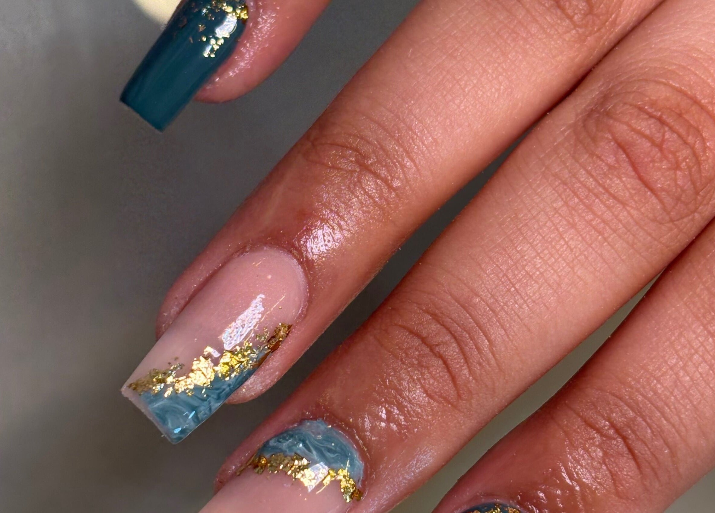 Elegant blue and gold marble nail art at Nails by Emily Katie, Burnley, England, GB.