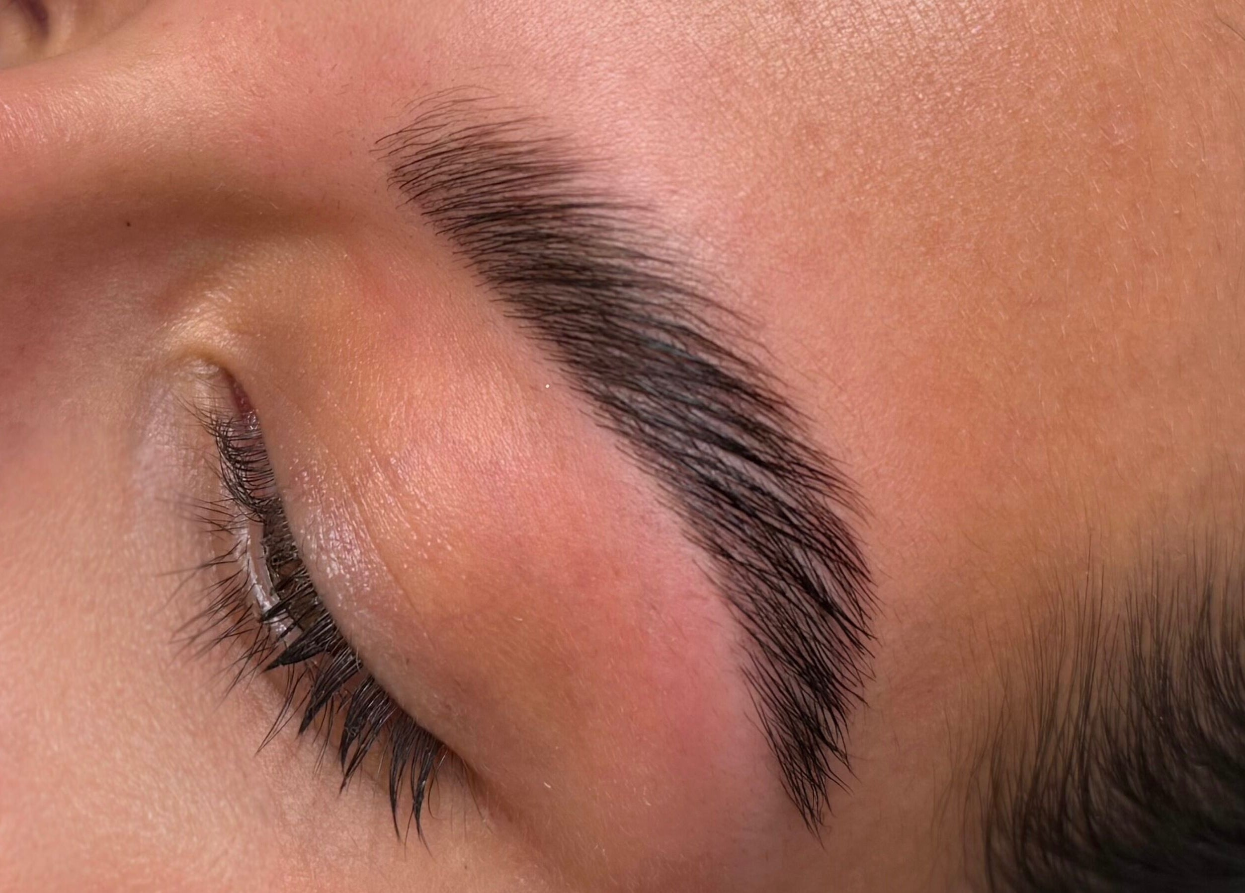 Expert eyebrow shaping at BROWZBYCASS, Cambridge, Ontario, CA, showcasing precision and style.
