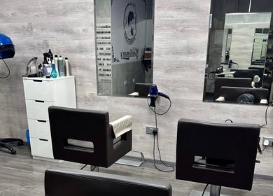 Modern interior at Chris Unisex Hair Salon, Paphos. Stylish chairs, mirrors, and hair equipment create a chic atmosphere.