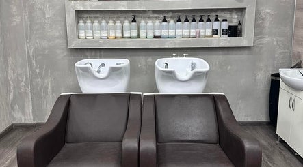 Two modern wash stations at Chris Unisex Hair Salon, Paphos, Paphos, CY; sleek design and professional products.