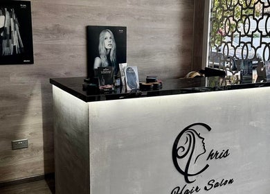 Elegant reception at Chris Unisex Hair Salon, Paphos, Paphos, CY, with stylish decor and modern art.