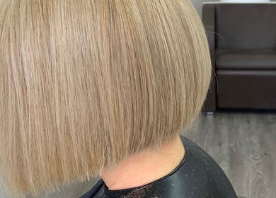 Sleek blonde bob hairstyle at Chris Unisex Hair Salon in Paphos, Paphos, CY.