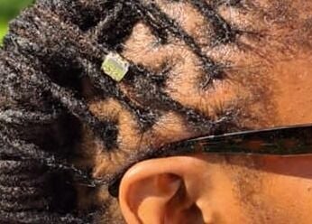 Close-up of intricate braids with a hair accessory at Stella's Spa, Gros Islet, Gros Islet, LC.