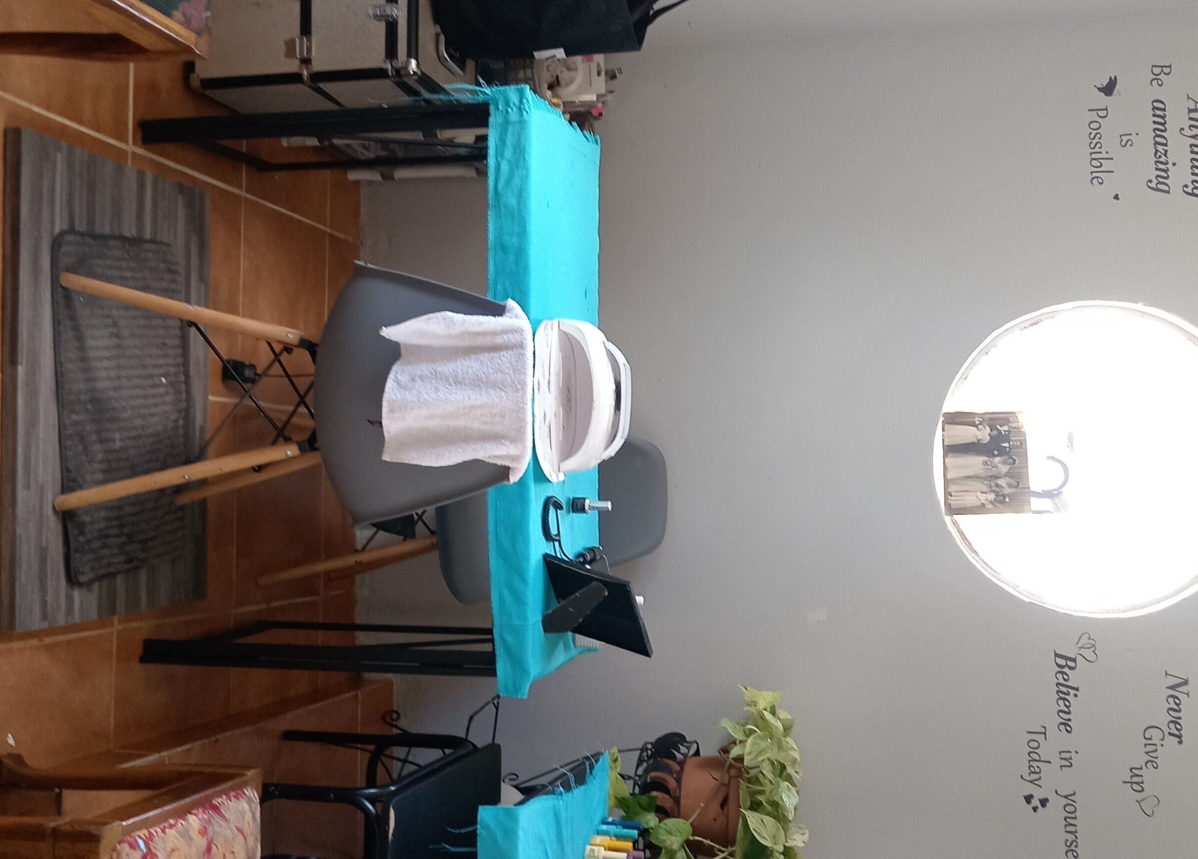 Treatment area with turquoise tablecloth at Milla Aesthetics, Randfontein, Gauteng, ZA. Cozy and inviting ambiance.