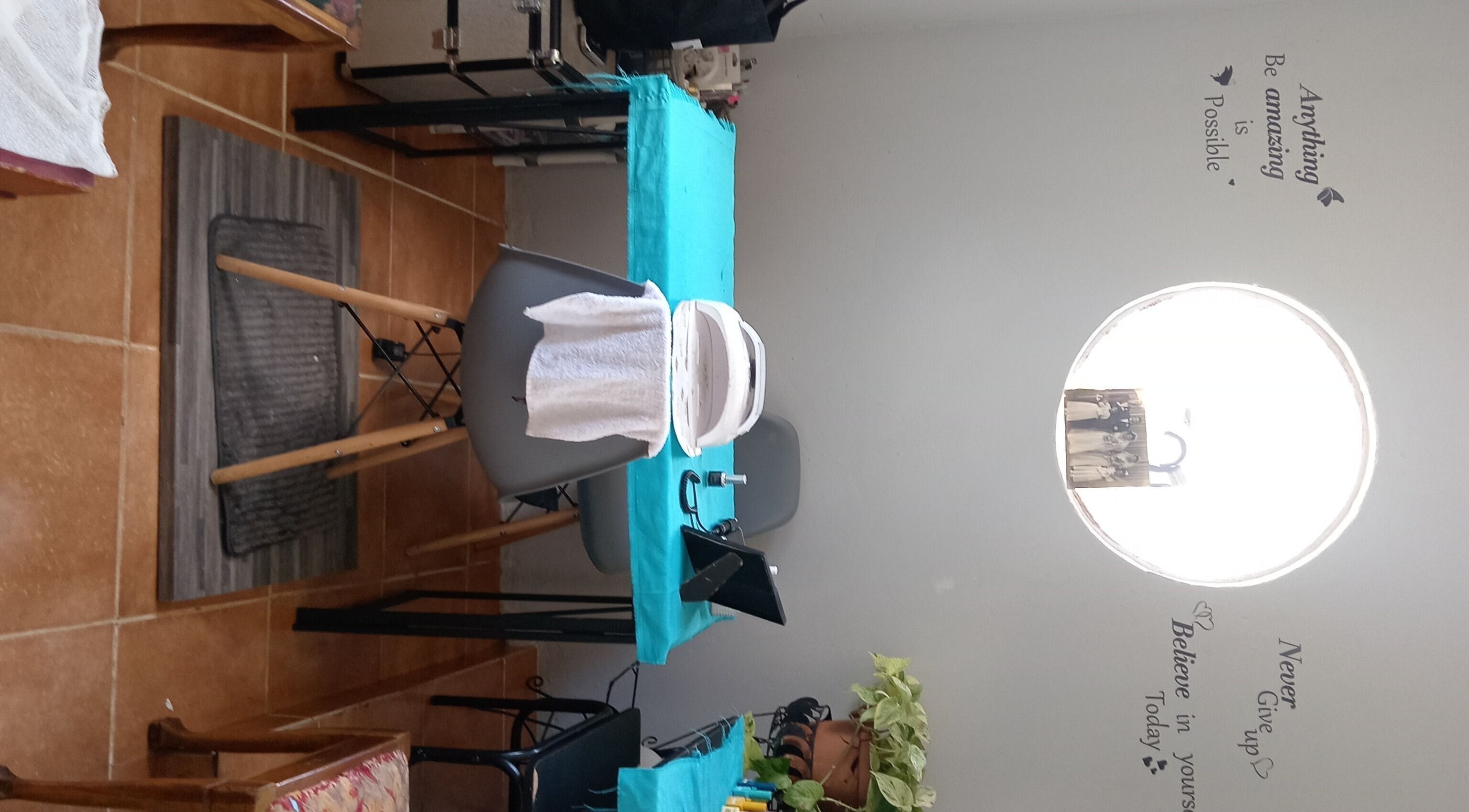 Treatment area with turquoise tablecloth at Milla Aesthetics, Randfontein, Gauteng, ZA. Cozy and inviting ambiance.