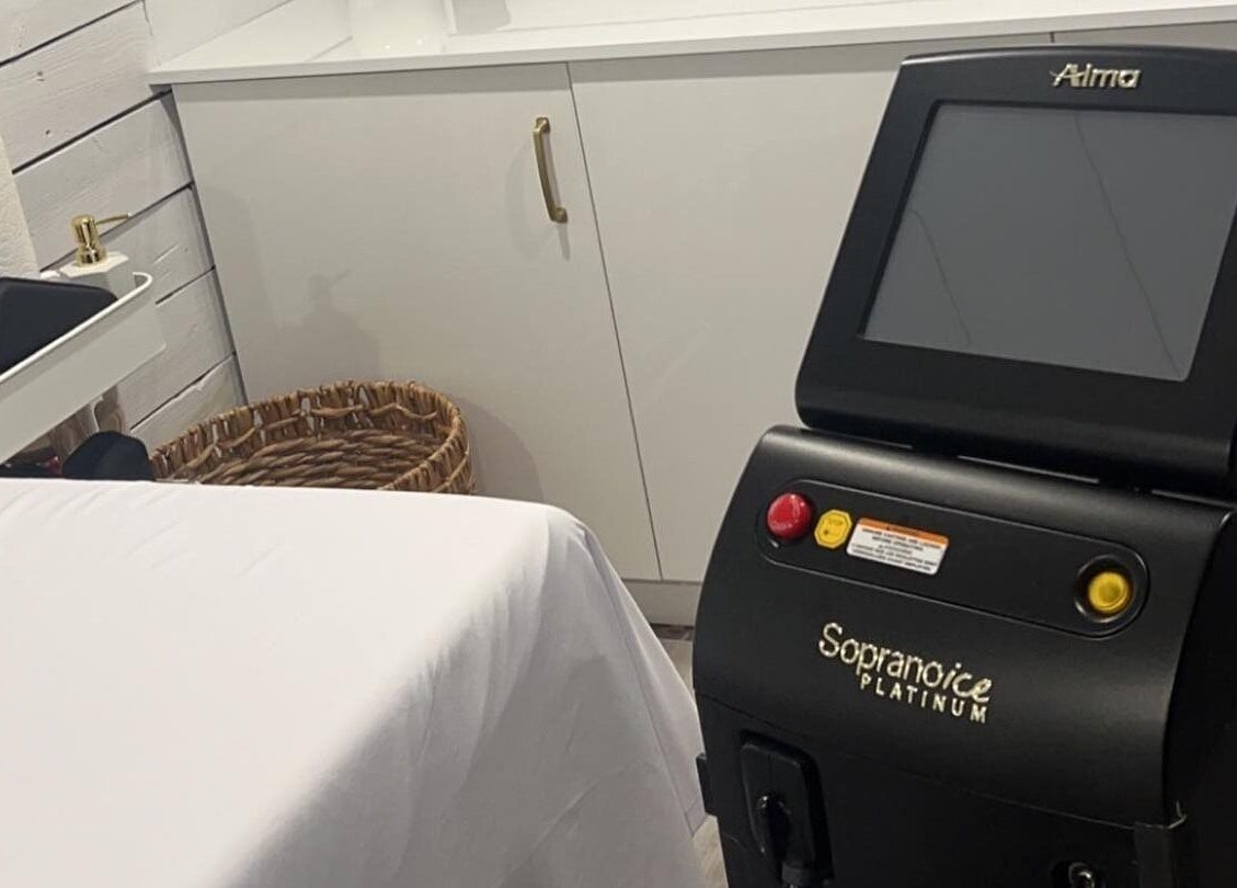 Laser treatment room at Bare Cabin, Port Colborne, Ontario, CA featuring advanced equipment and cozy decor.