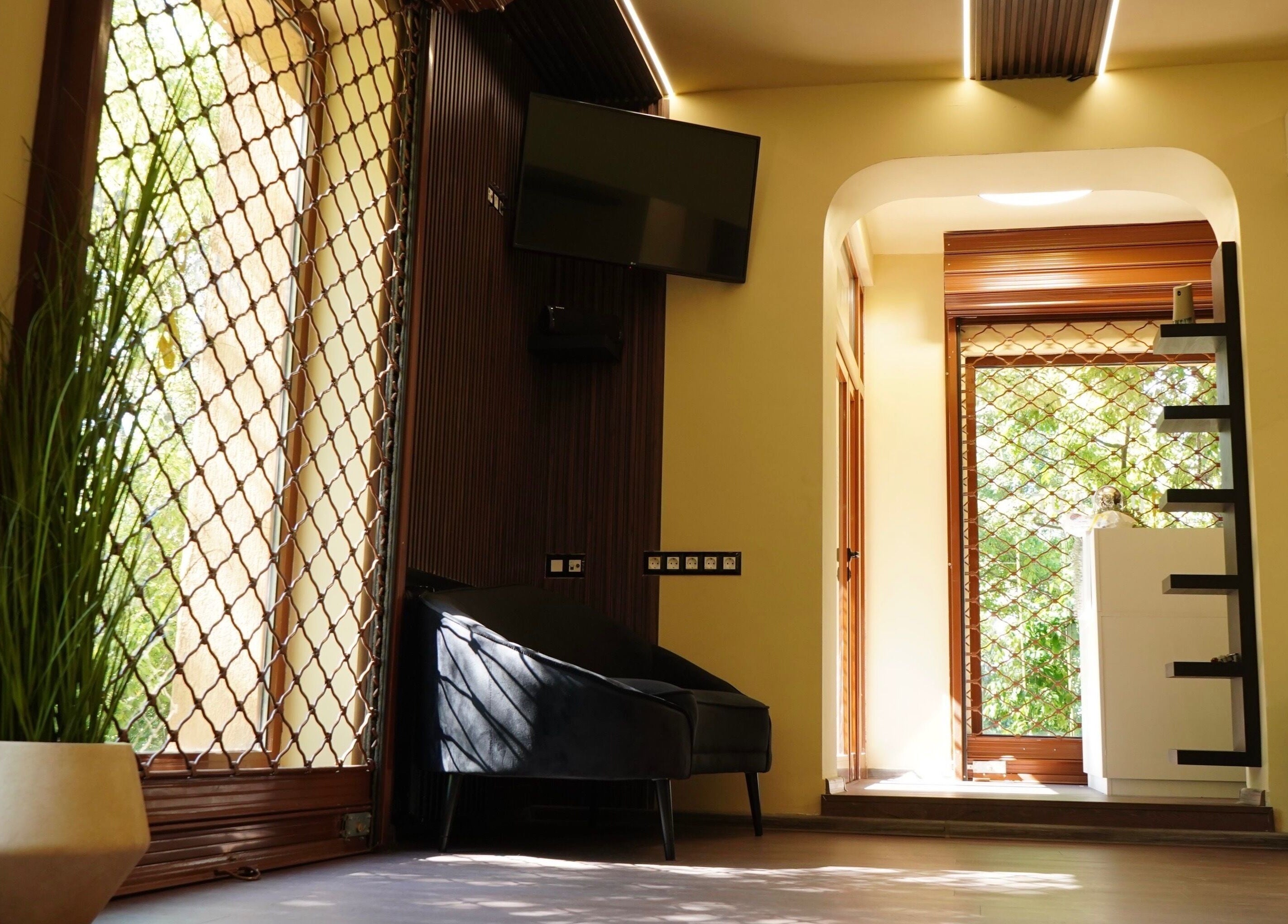 Relaxing lounge area at Masquerade, Sofia, Sofia City Province, BG with modern decor and ambient lighting.