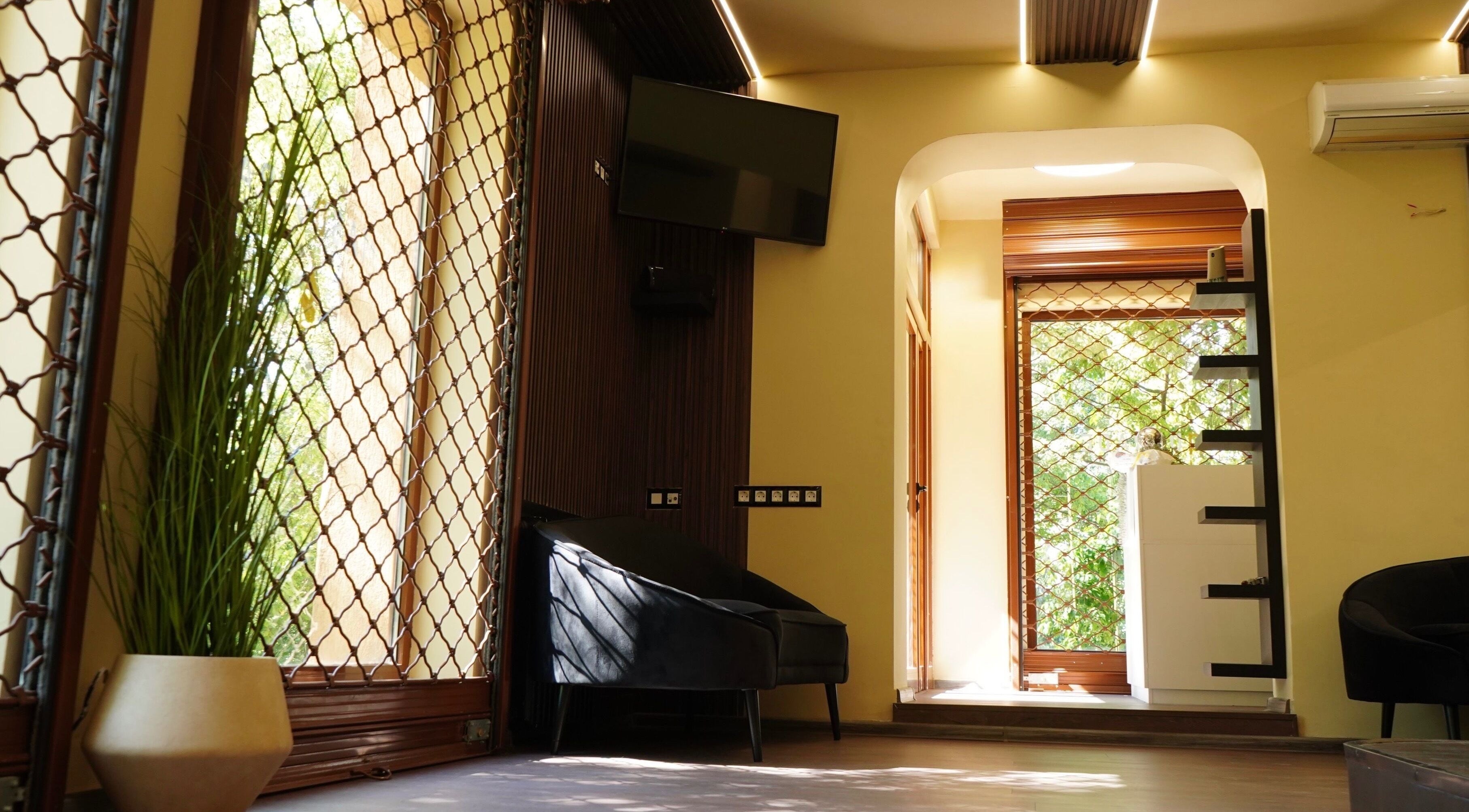 Relaxing lounge area at Masquerade, Sofia, Sofia City Province, BG with modern decor and ambient lighting.