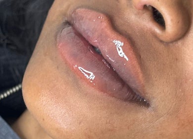 Close-up of glossy lips at Boss Babe Beauty And Aesthetics in London, England, GB.