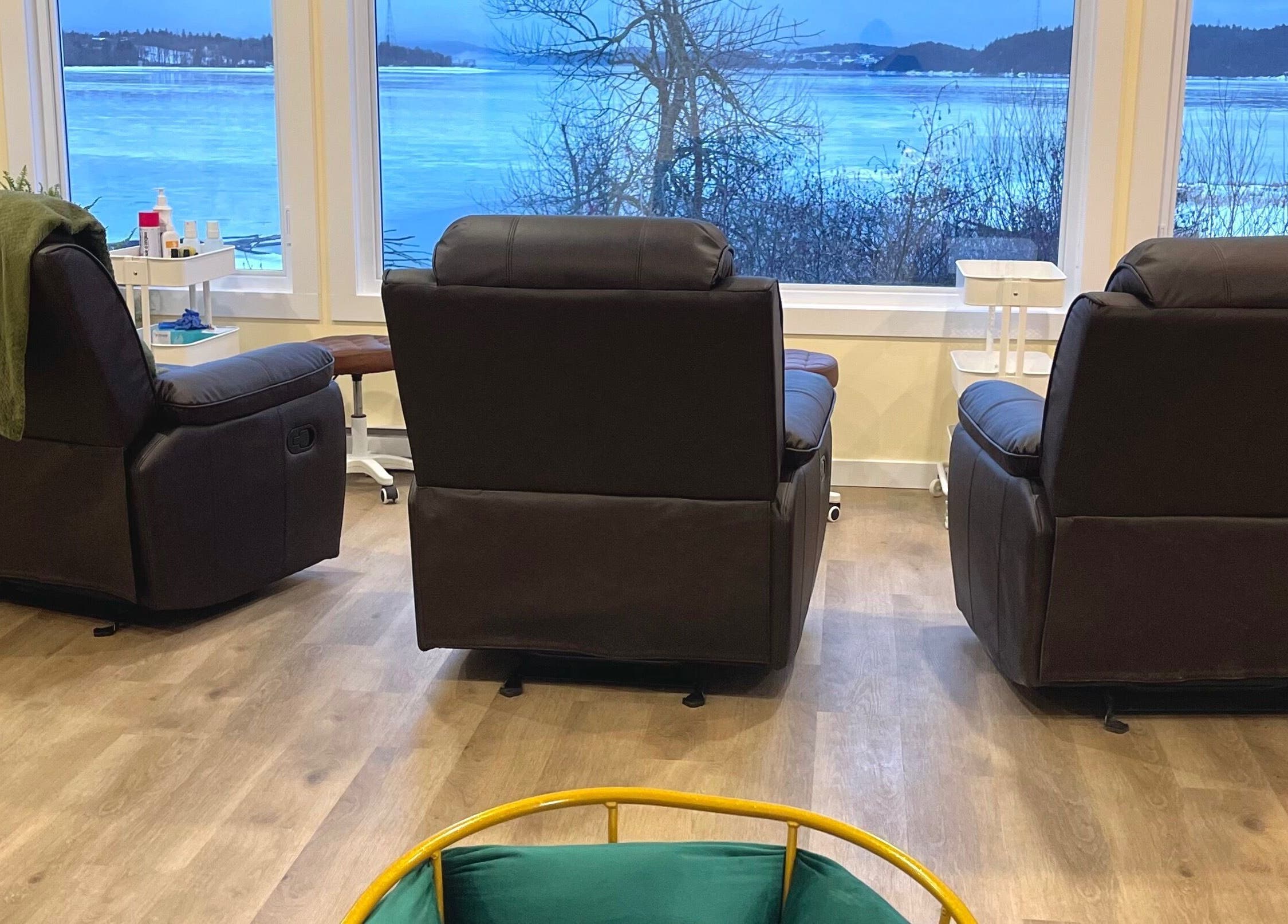 Comfortable seating with scenic view at Water’s Edge Aesthetics, Saint John, New Brunswick, CA.