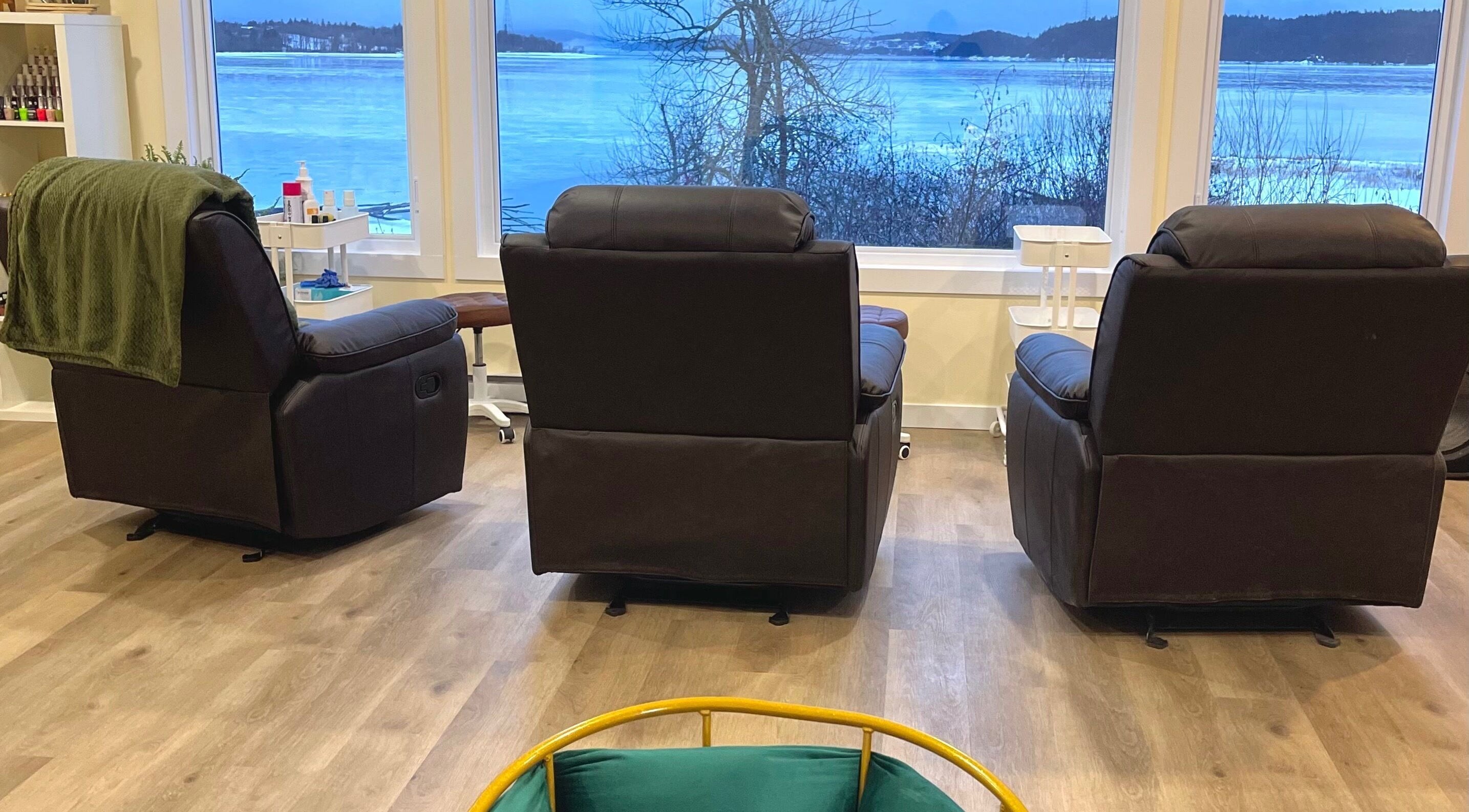 Comfortable seating with scenic view at Water’s Edge Aesthetics, Saint John, New Brunswick, CA.