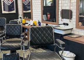 Stylish interior of Uncle Joes Barber - Fremantle, featuring modern barber chairs in Fremantle, Western Australia, AU.