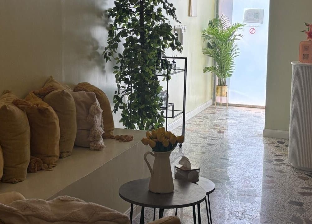 Cozy seating area in Brillante Spa, Riyadh, Riyadh Province, SA, with plants and cushions enhancing relaxation.