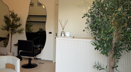 Interior of Mothers and Daughters Beauty Salon L.L.C in Dubai, Dubai, AE, with stylish decor and seating.