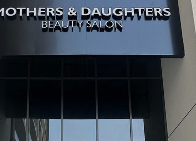 Exterior view of Mothers and Daughters Beauty Salon L.L.C in Dubai, Dubai, AE with sleek modern signage.