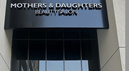 Exterior view of Mothers and Daughters Beauty Salon L.L.C in Dubai, Dubai, AE with sleek modern signage.