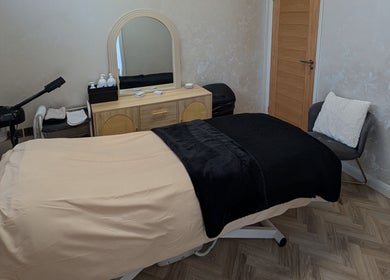 Relaxing spa room at Charli's Beauty Company, Southend-on-sea, England. Cozy treatment table and soothing decor.