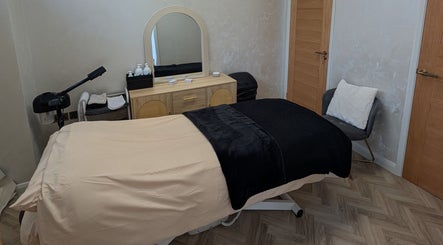 Relaxing spa room at Charli's Beauty Company, Southend-on-sea, England. Cozy treatment table and soothing decor.