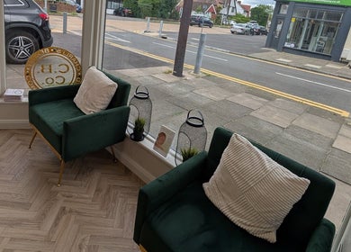 Stylish green seating area at Charli's Beauty Company, Southend-on-Sea, England, GB.