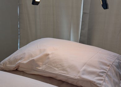 Plush treatment bed at Charli's Beauty Company, Southend-on-sea, England, GB, under warm lighting.