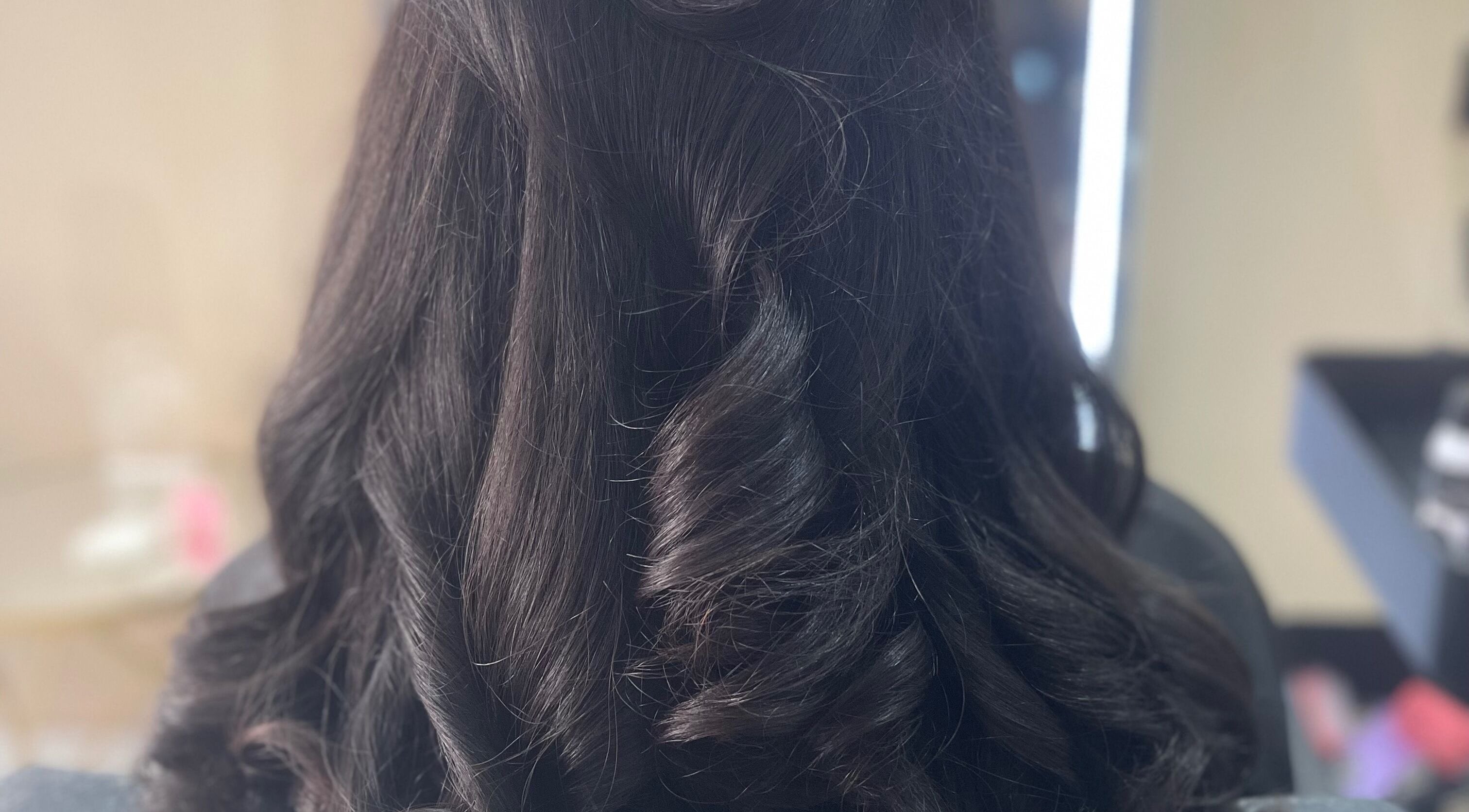 Stunning curled hairstyle at Hair By Cora-Leigh, Saltney, England, GB, showcasing expert styling.