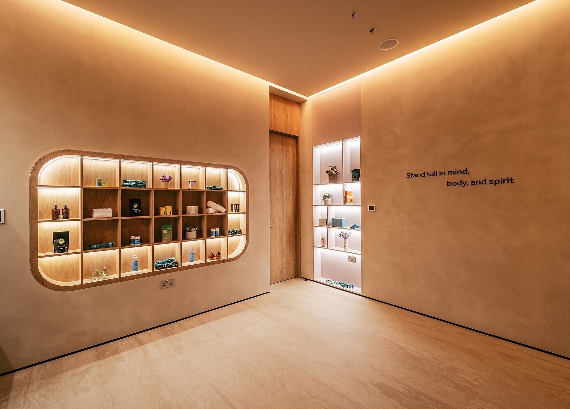 Wellnest reception area with warm lighting and elegant shelves in Dubai, AE.