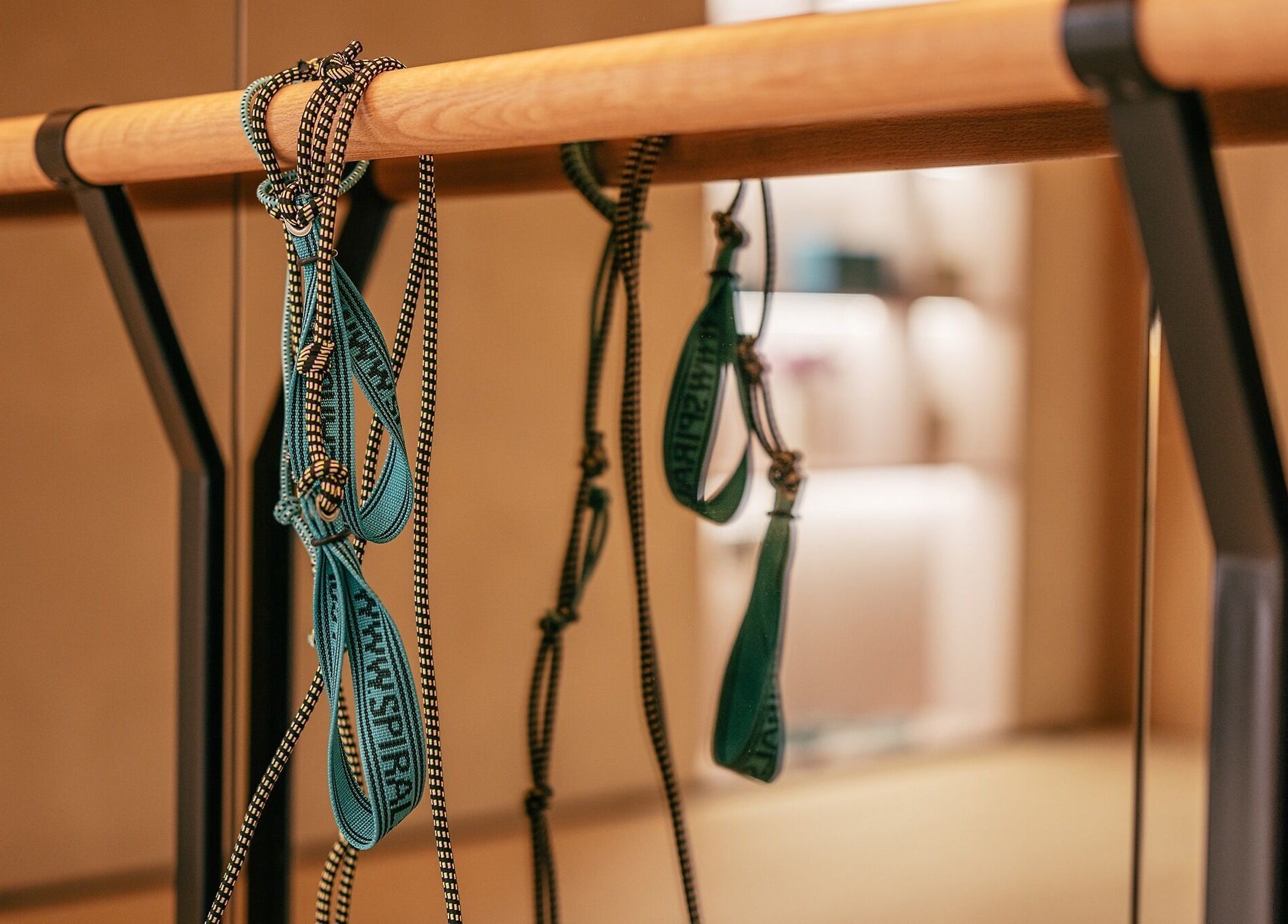 Yoga straps hanging at Wellnest studio in Dubai, AE, reflecting tranquility and wellness focus.
