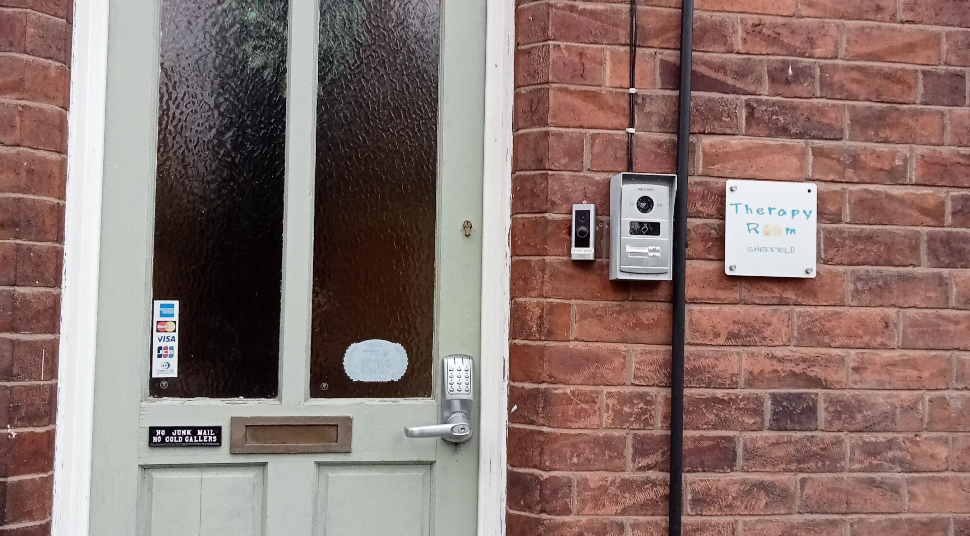 Entrance to Therapy Room Sheffield S7 with keypad and sign, located in Sheffield, England, GB.