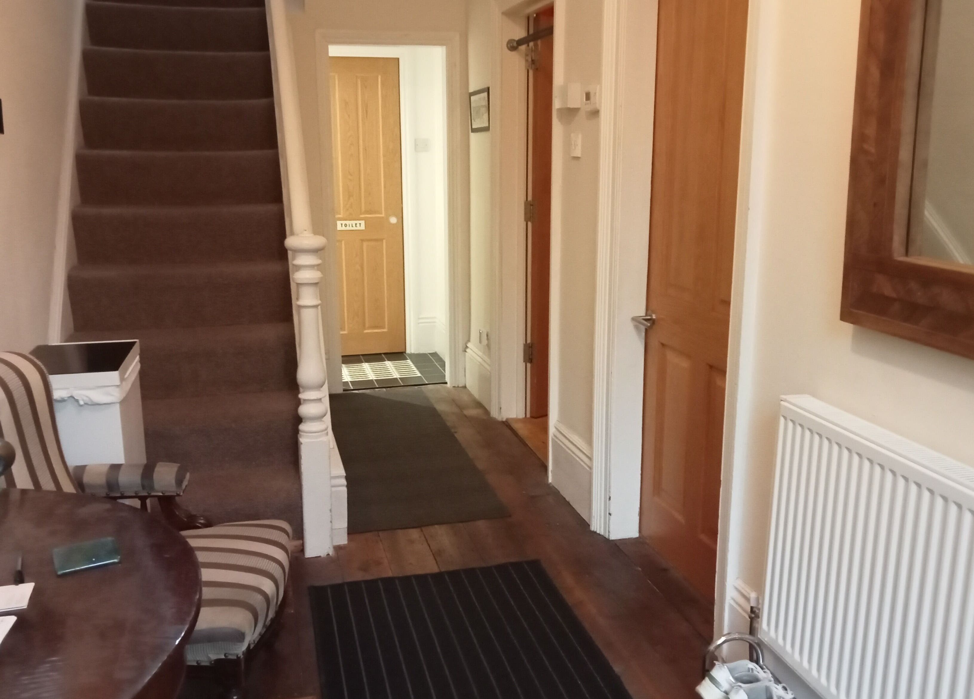 Cozy entrance of Therapy Room Sheffield S7 with striped chairs in Sheffield, England, GB.