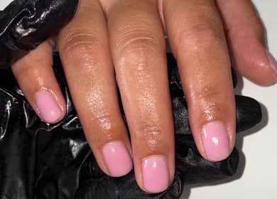 Close-up of glossy pink nails by Nails By Karli in Peterborough, England, GB showcasing a stylish manicure.