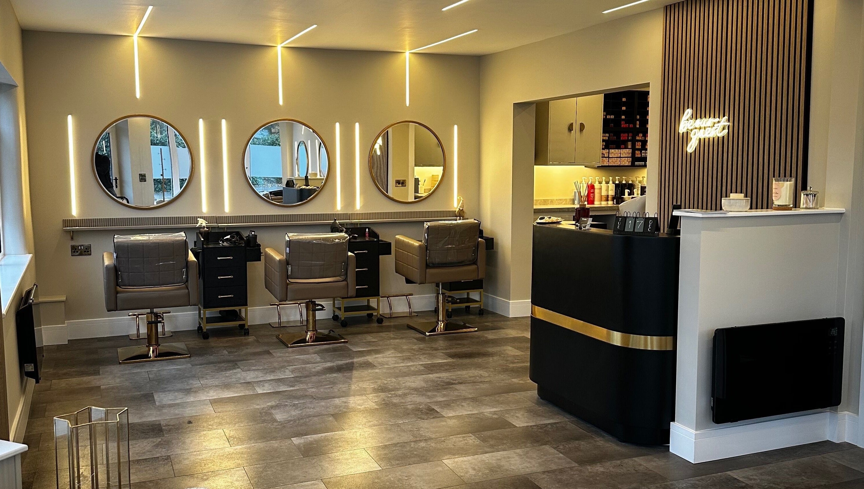 Halt Salon interior in Nottingham, GB. Features modern styling stations with mirrors and sleek decor.