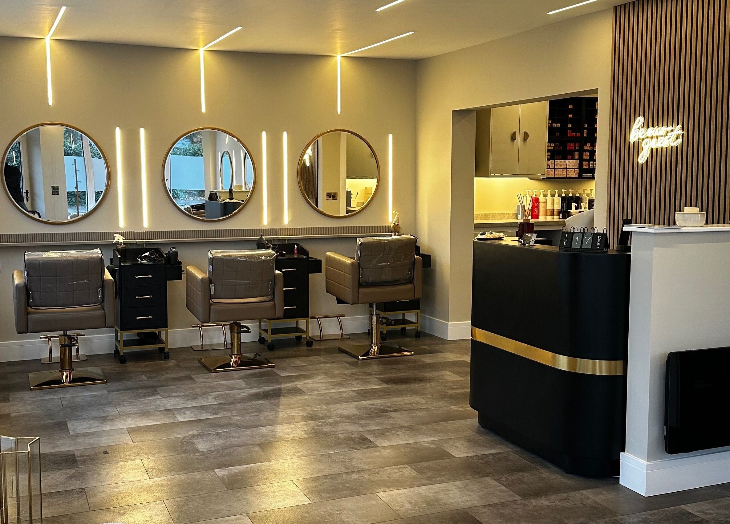 Halt Salon interior in Nottingham, GB. Features modern styling stations with mirrors and sleek decor.