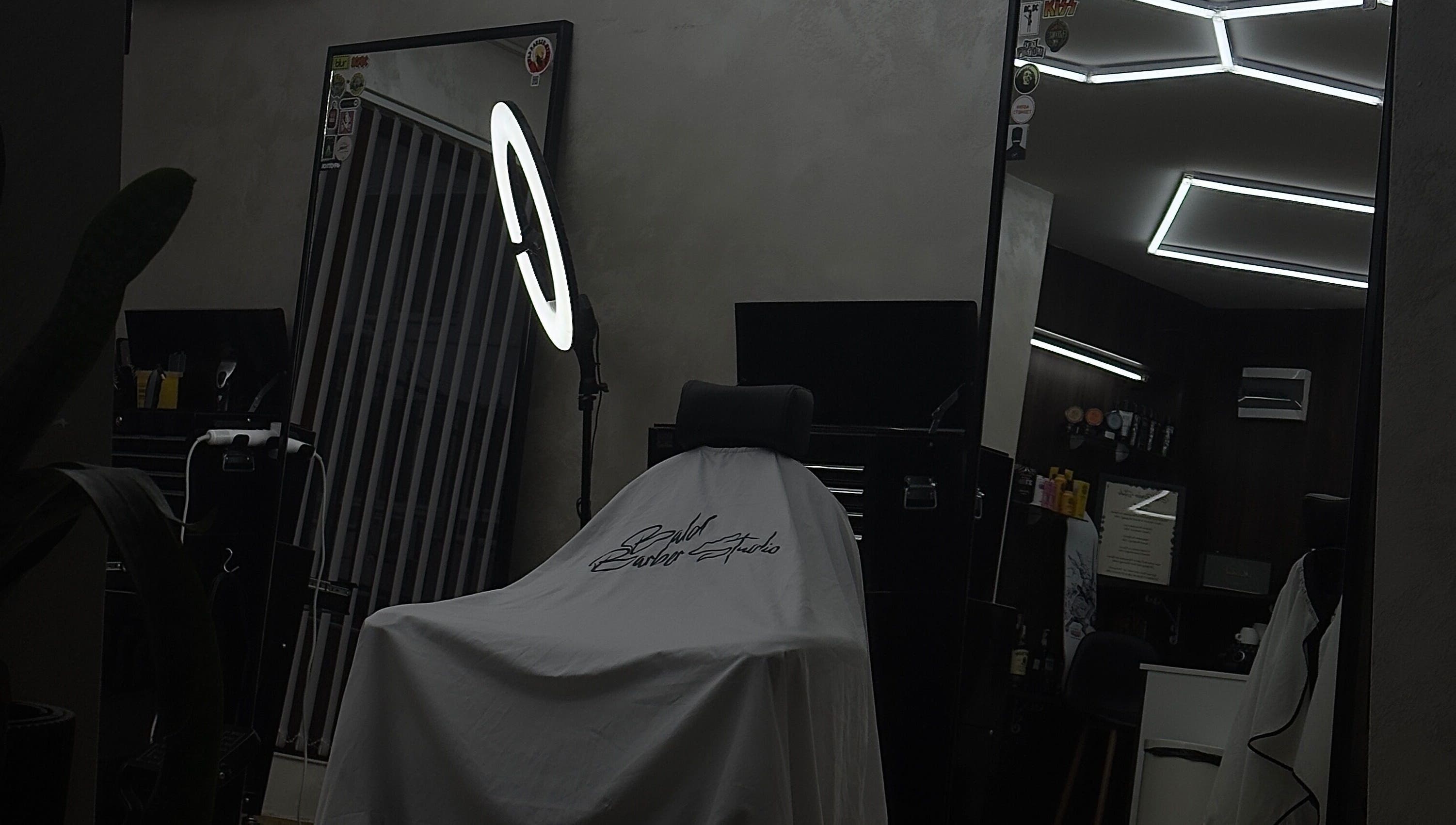 Modern barbershop interior at Bald Barber Studio, Varna, Varna, BG featuring sleek mirrors and styling tools.