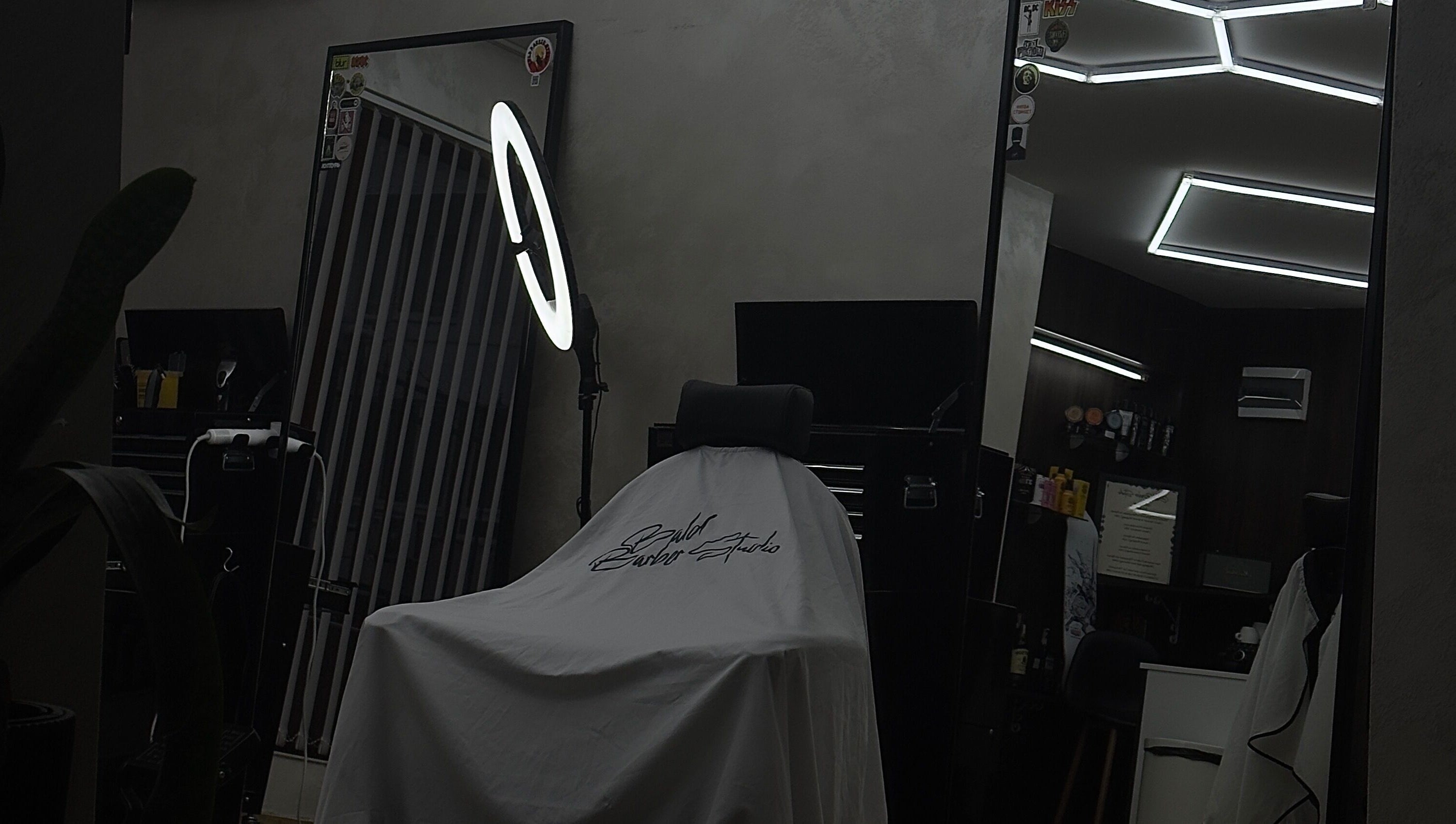 Modern barbershop interior at Bald Barber Studio, Varna, Varna, BG featuring sleek mirrors and styling tools.