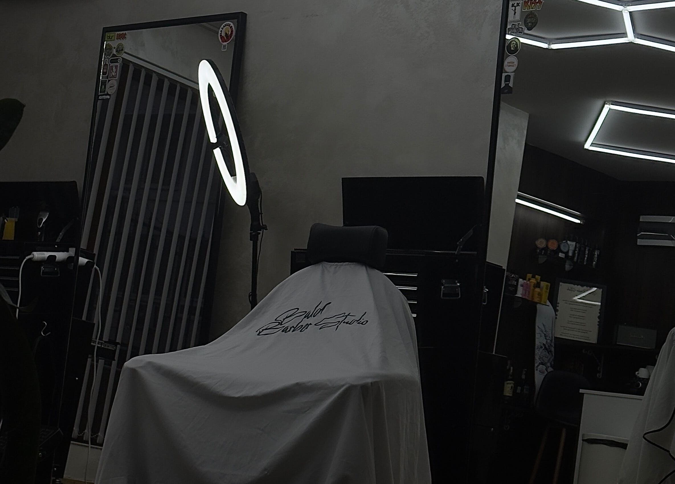 Modern barbershop interior at Bald Barber Studio, Varna, Varna, BG featuring sleek mirrors and styling tools.