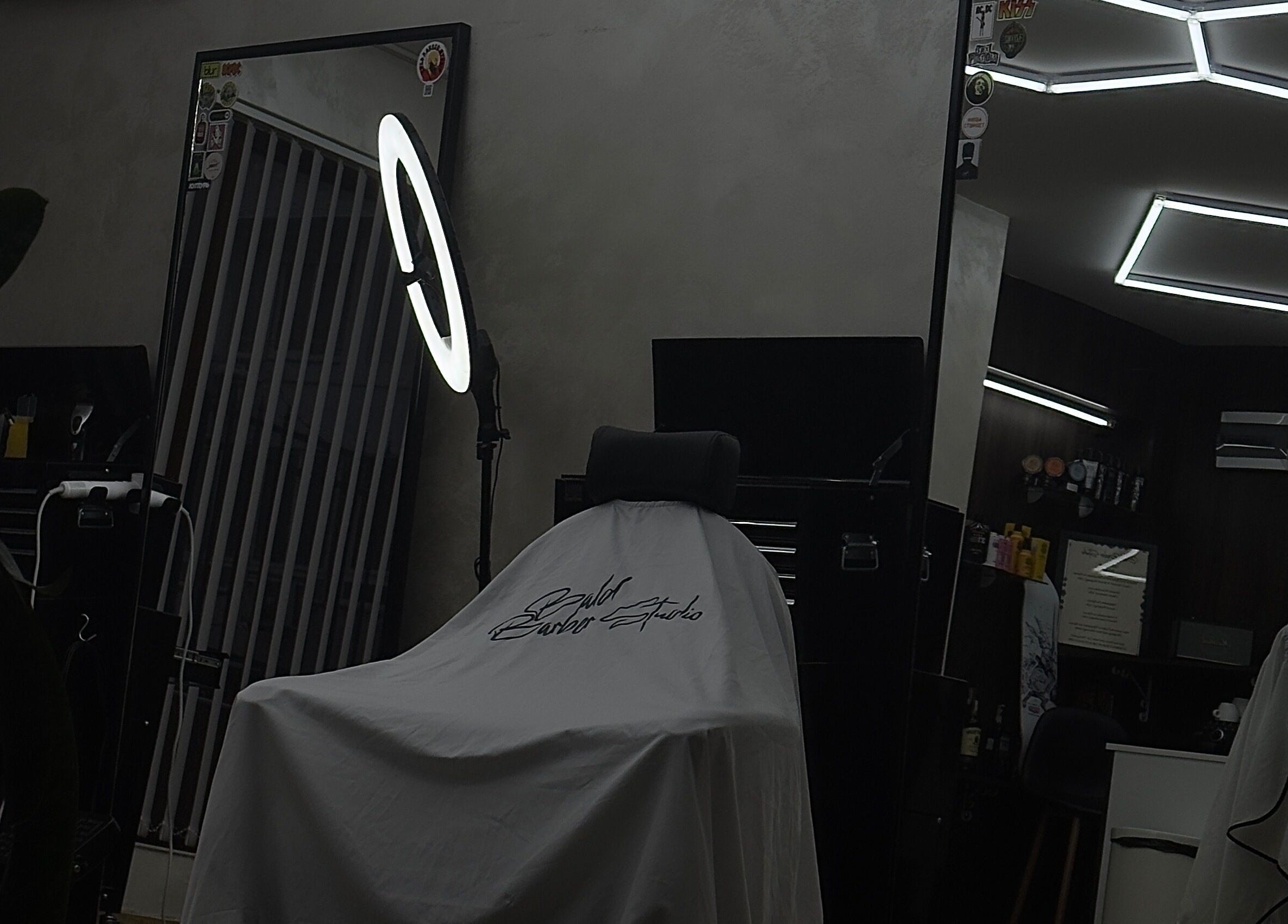 Modern barbershop interior at Bald Barber Studio, Varna, Varna, BG featuring sleek mirrors and styling tools.