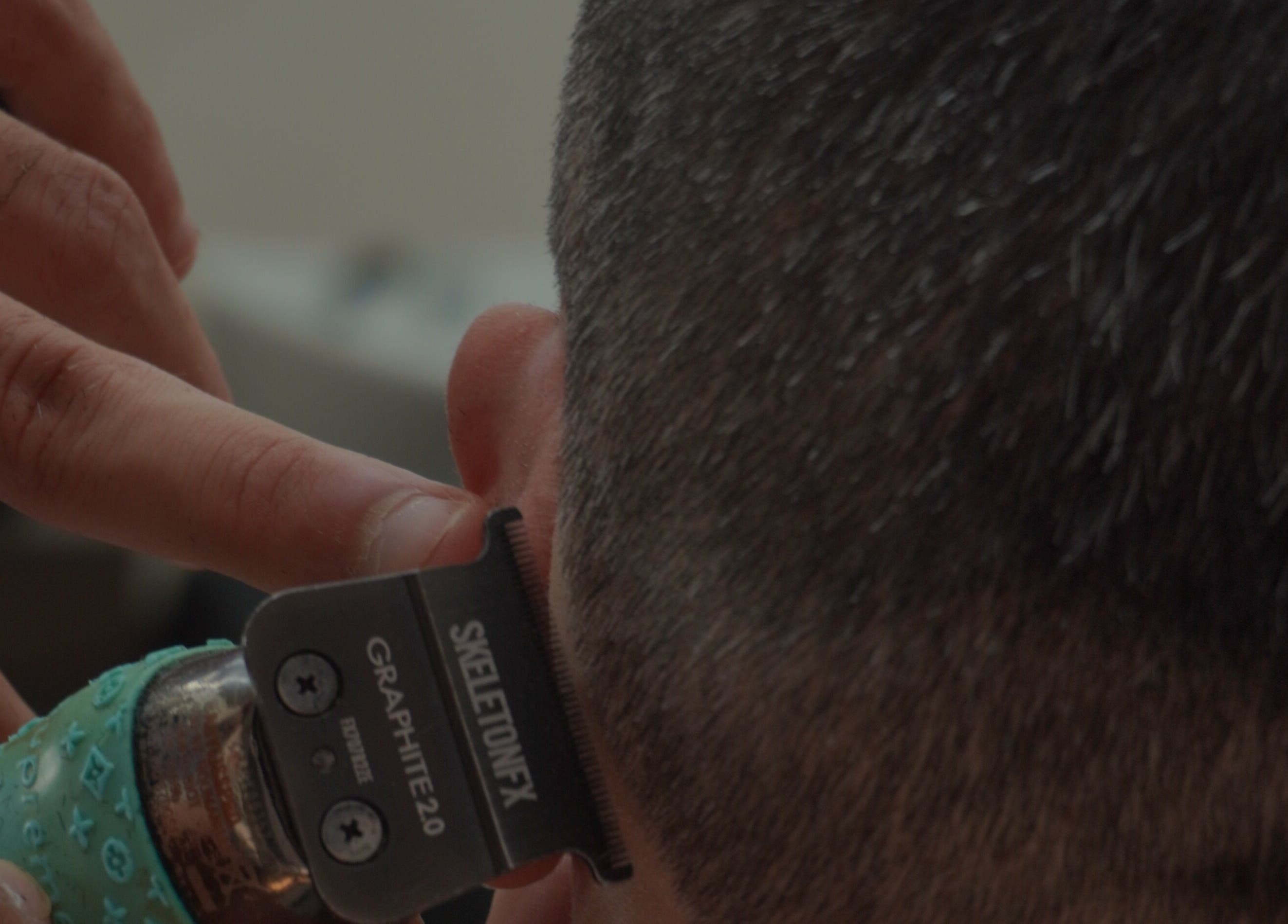 Close-up of precise haircutting at Bald Barber Studio, Varna, Varna, BG. Expertise in modern grooming.