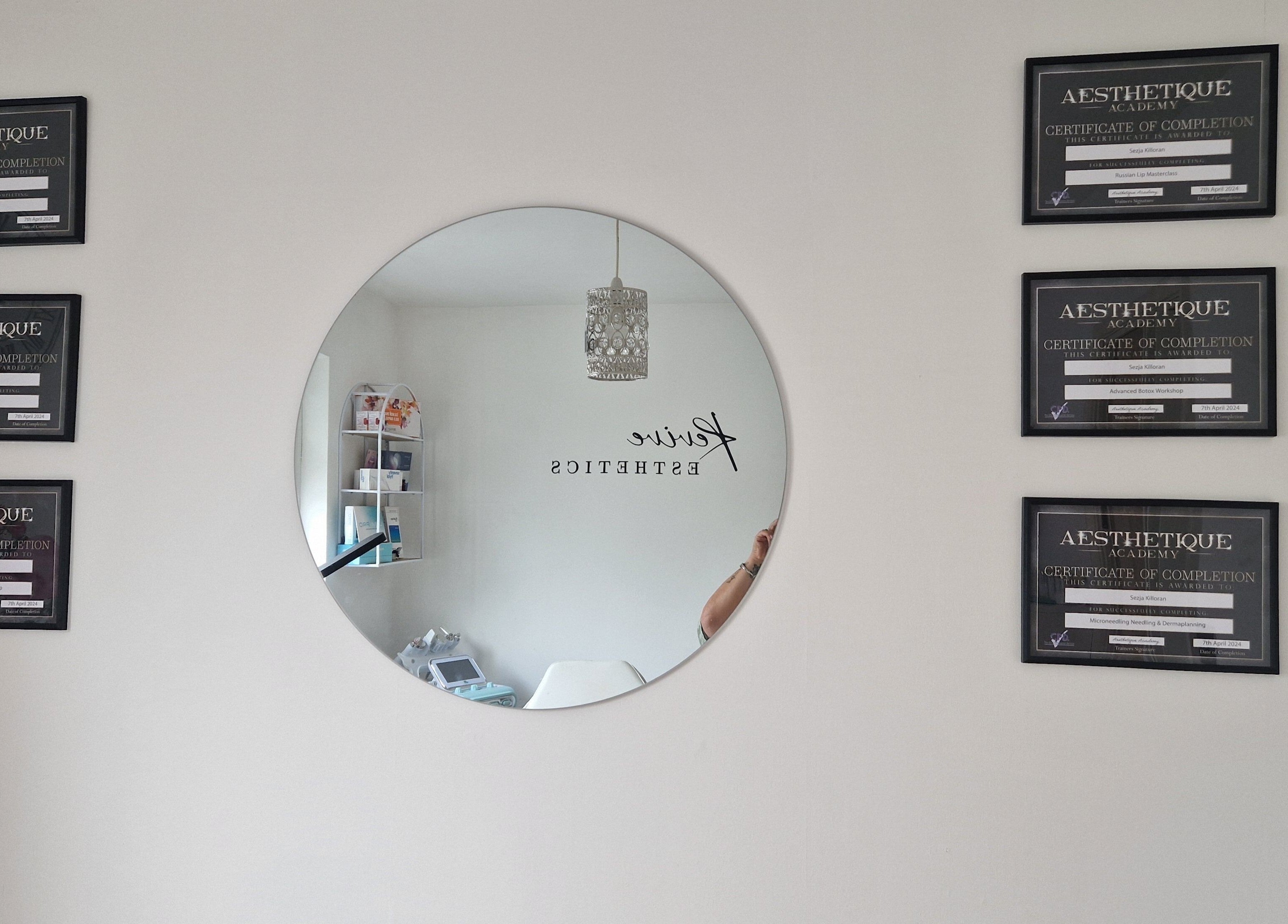 Elegant decor with certificates at Revive Esthetics, Peacehaven, England, GB, reflecting professionalism.