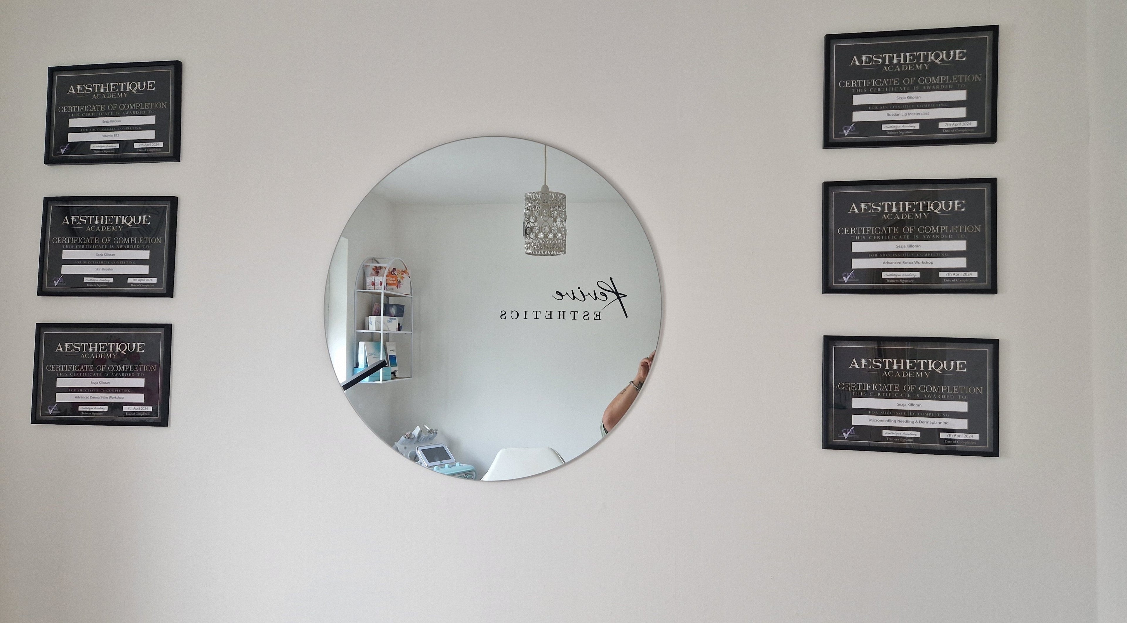 Elegant decor with certificates at Revive Esthetics, Peacehaven, England, GB, reflecting professionalism.