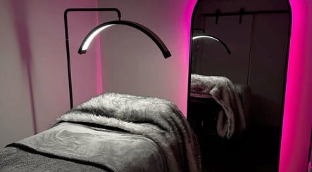 Cozy beauty room with glowing pink lights at Winked by O in Lagos, Lagos, NG.
