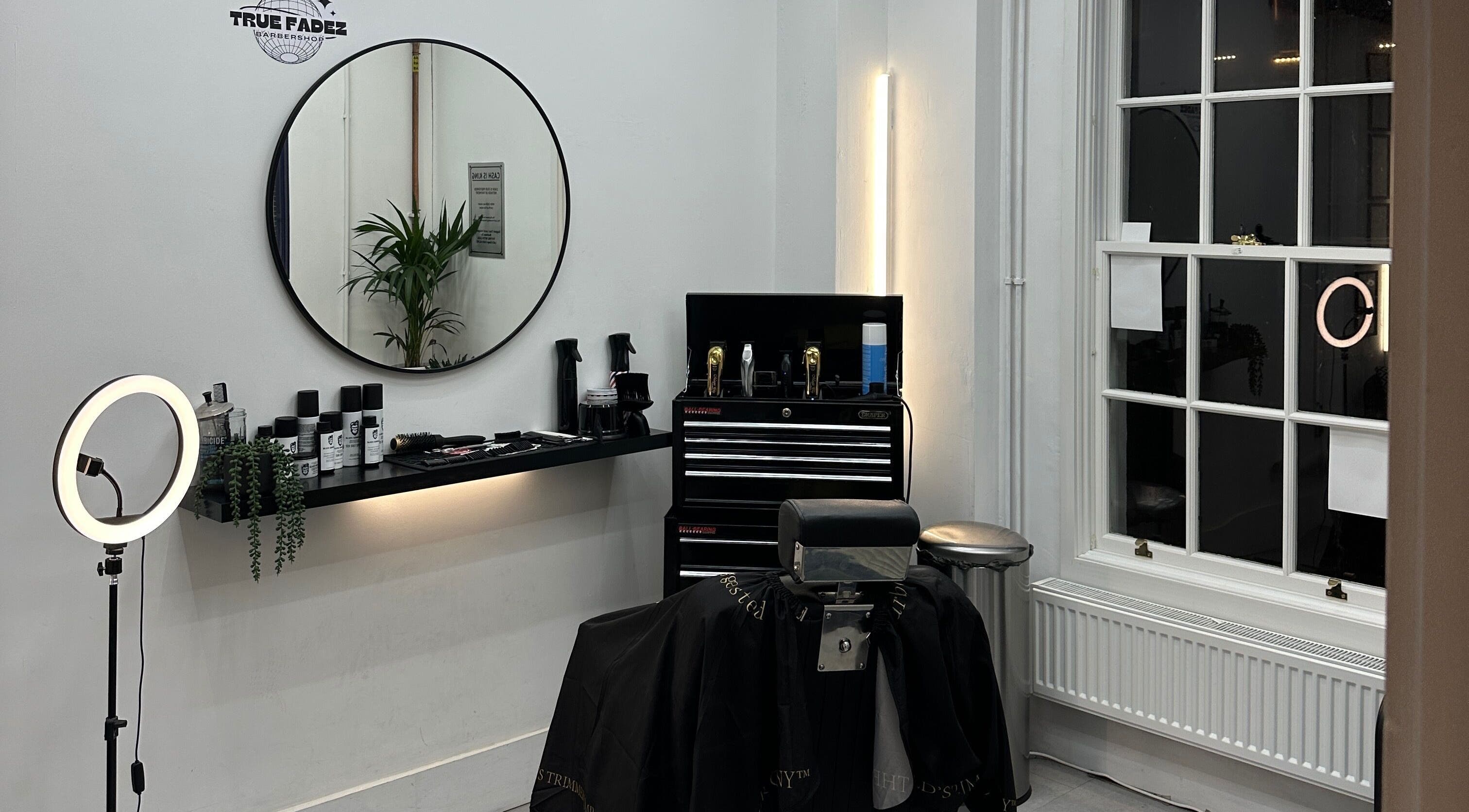 Modern barber station at True Fadez, Castletown, featuring tools and a stylish mirror.