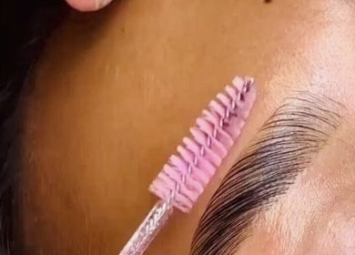 Eyebrow grooming at Khanyela Luxe Studio, Randburg, Gauteng, ZA, showcasing precise brush techniques.